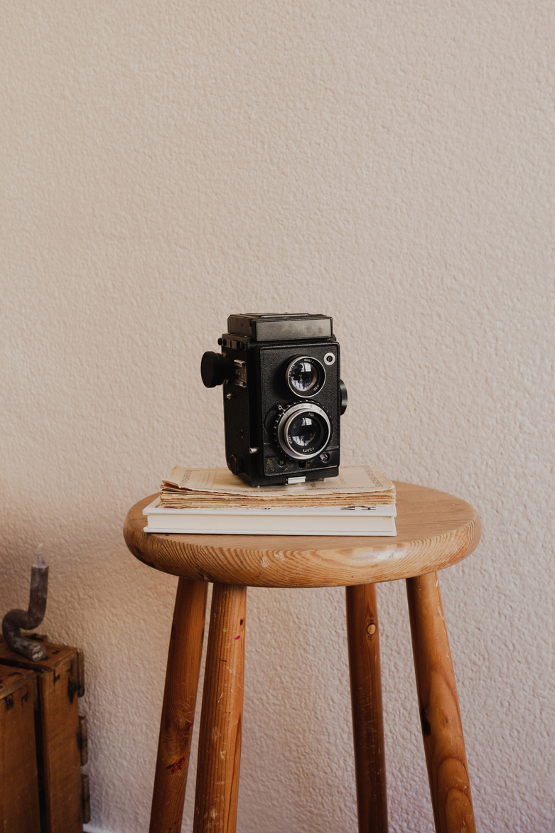 Film Camera on Wooden Stool